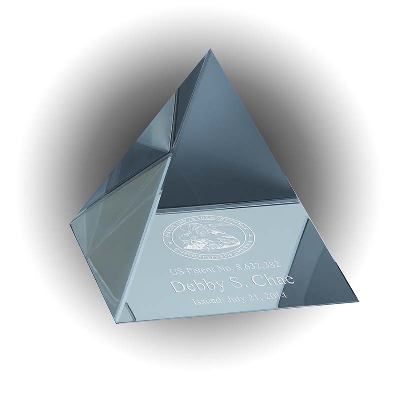 Solid crystal pyramid patent and inventor award with engraved USPTO seal and inventor details