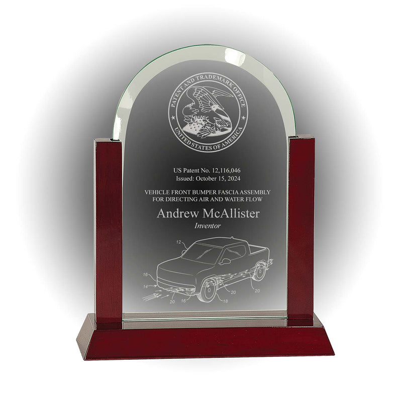 Arch-top jade glass patent and inventor award with engraved USPTO seal and rosewood piano base