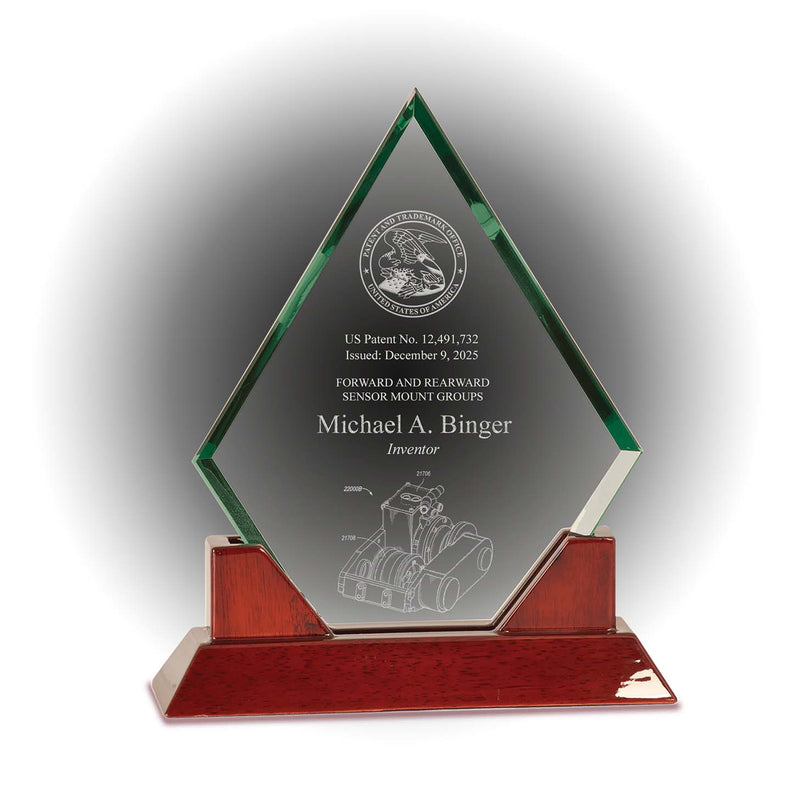 Diamond-shaped jade glass patent and inventor award with engraved USPTO seal and rosewood piano base