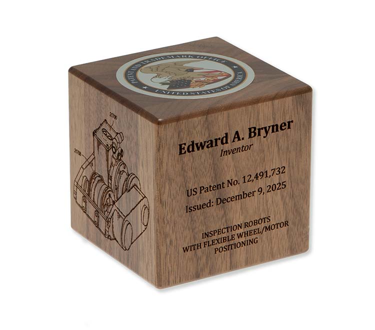Walnut inventor cube with silver color USPTO seal disc, desktop display