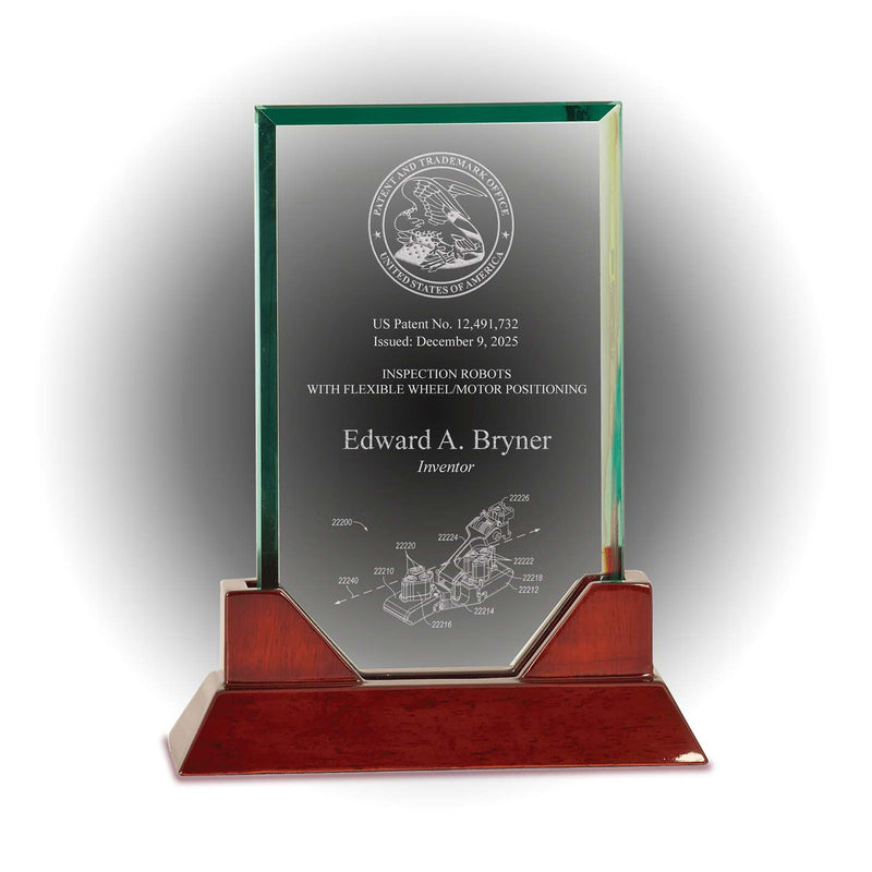 Rectangle jade glass patent and inventor award with engraved USPTO seal and rosewood piano base